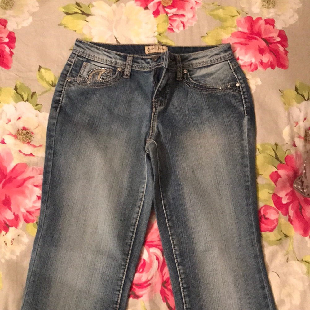 Faded blue jeans with comfortable fit.